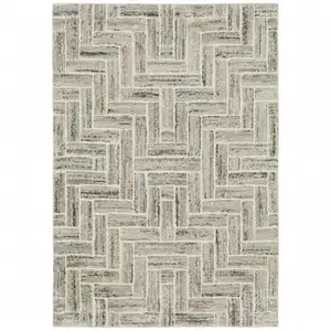 Photo of Ivory Beige Grey Brown Pale Blue And Charcoal Geometric Power Loom Stain Resistant Area Rug