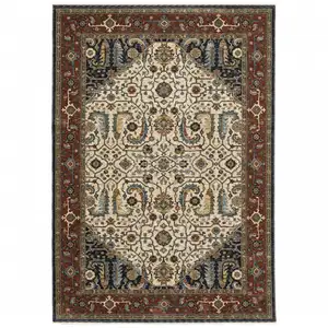 Photo of Ivory Beige Red Blue Gold Green And Navy Oriental Power Loom Stain Resistant Area Rug With Fringe