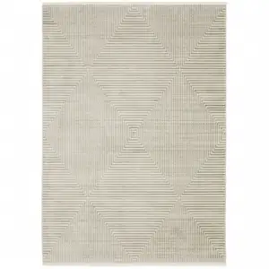 Photo of Ivory Beige Taupe And Tan Geometric Power Loom Stain Resistant Area Rug With Fringe