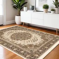 Photo of Ivory Black And Tan Medallion Area Rug With Fringe