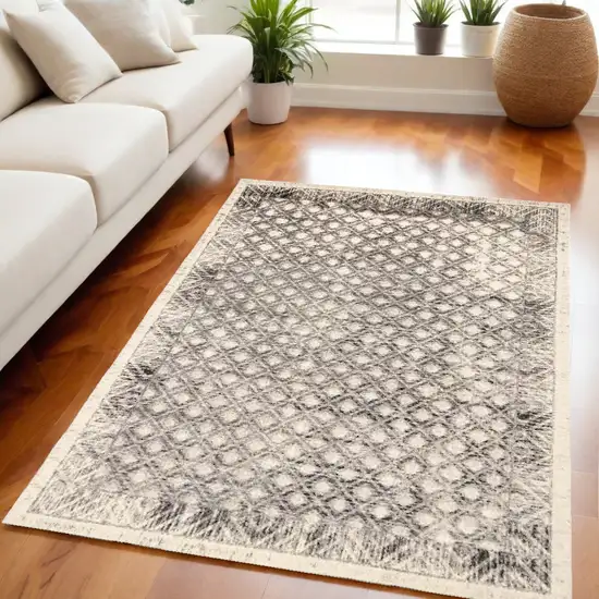 Ivory Black And Taupe Abstract Stain Resistant Area Rug Photo 1