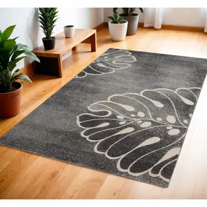 Photo of Ivory Black and Gray Botanical Leaves Area Rug