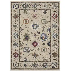 Photo of Ivory Blue And Light Brown Floral Area Rug With Fringe