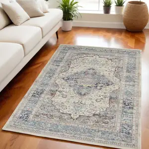 Photo of Ivory Blue And Orange Floral Distressed Area Rug