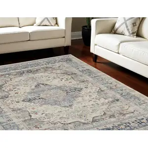 Photo of Ivory Blue And Orange Floral Medallion Distressed Non Skid Area Rug