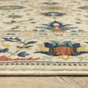 Photo of Ivory Blue And Orange Oriental Area Rug With Fringe