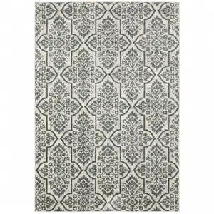 Photo of Ivory Blue And Sage Floral Power Loom Stain Resistant Area Rug