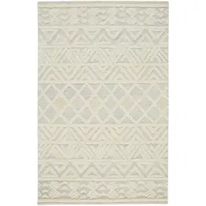 Photo of Ivory Blue And Tan Wool Geometric Tufted Handmade Stain Resistant Area Rug