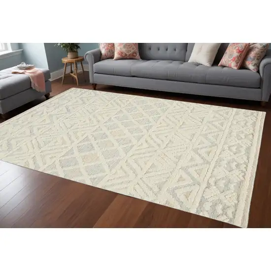 Ivory Blue And Tan Wool Geometric Tufted Handmade Stain Resistant Area Rug Photo 1