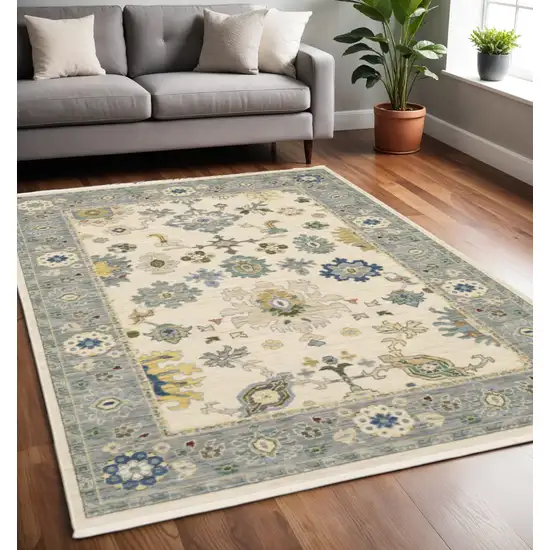 Ivory and Blue Oriental Power Loom Area Rug With Fringe Photo 1