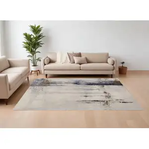 Photo of Ivory Blue and Brown Abstract Power Loom Area Rug