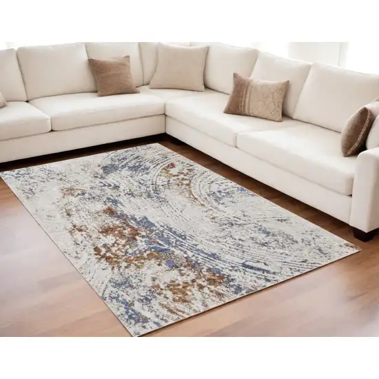 Ivory Blue and Brown Abstract Power Loom Area Rug Photo 1