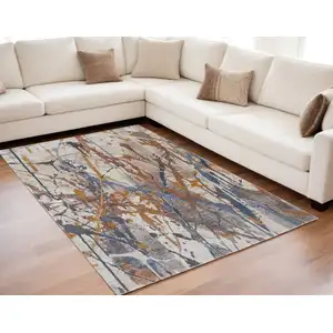 Photo of Ivory Blue and Brown Abstract Power Loom Area Rug