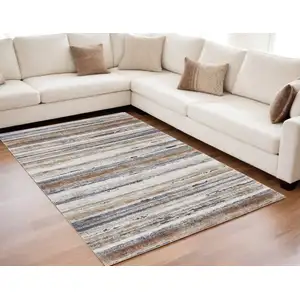 Photo of Ivory Blue and Brown Striped Power Loom Area Rug