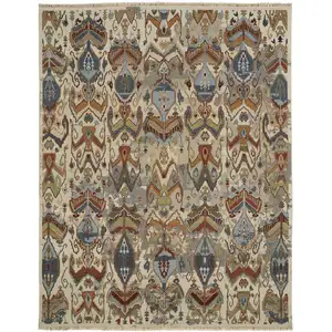 Photo of Ivory Blue and Brown Wool Ikat Hand Knotted Area Rug With Fringe