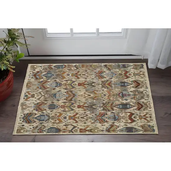 Ivory Blue and Brown Wool Ikat Hand Knotted Area Rug With Fringe Photo 1