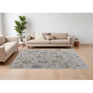 Photo of Ivory Blue and Gold Floral Power Loom Worn Faded Area Rug With Fringe