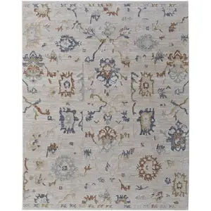 Photo of Ivory Blue and Gold Floral Power Loom Worn Faded Area Rug With Fringe