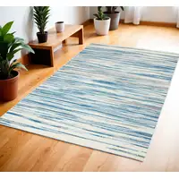 Photo of Ivory Blue and Gray Striped Area Rug