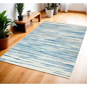 Photo of Ivory Blue and Gray Striped Area Rug