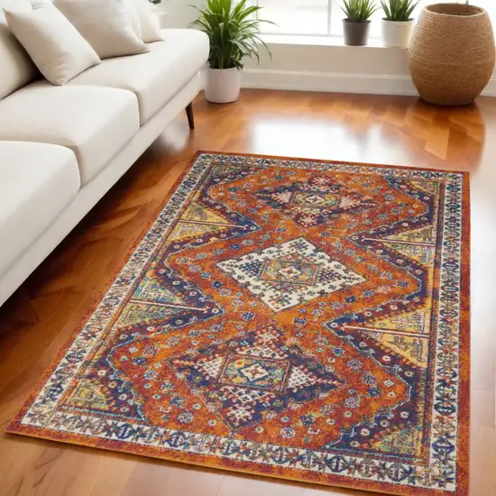 Ivory Blue and Orange Geometric Power Loom Area Rug Photo 1