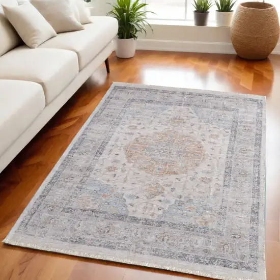 Ivory Blue and Orange Oriental Hand Woven Distressed Area Rug With Fringe Photo 1