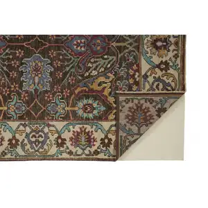 Photo of Ivory Brown And Blue Wool Floral Hand Knotted Distressed Stain Resistant Area Rug With Fringe