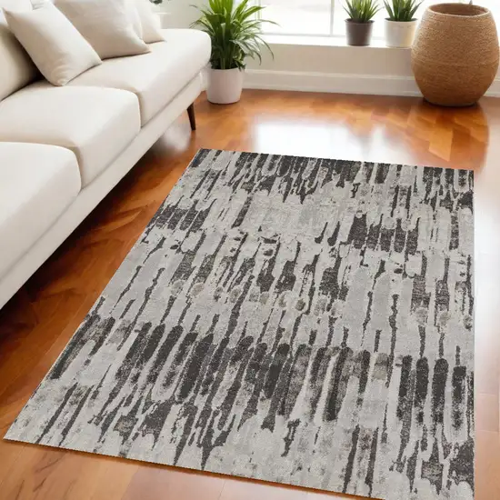 Gray and Ivory Abstract Power Loom Area Rug Photo 1