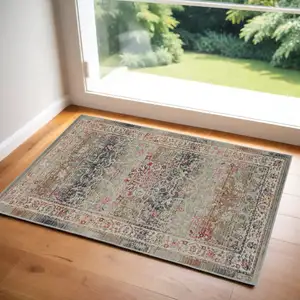 Photo of Ivory Brown And Gray Floral Distressed Area Rug