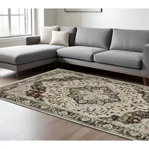 Photo of Ivory Brown And Red Medallion Area Rug With Fringe