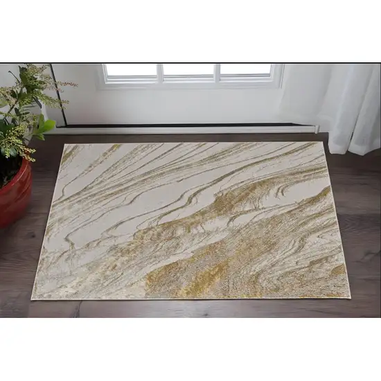 Ivory Brown and Gold Abstract Power Loom Area Rug Photo 1