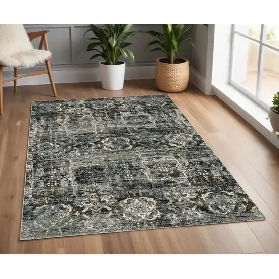 Ivory and Black Oriental Power Loom Area Rug Photo 1