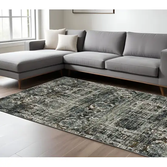 Ivory and Black Oriental Power Loom Area Rug Photo 1