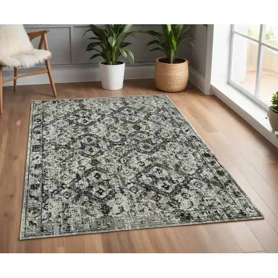 Ivory and Black Oriental Power Loom Area Rug Photo 1