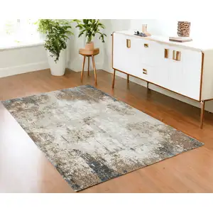 Photo of Ivory Charcoal and Taupe Abstract Distressed Non Skid Area Rug