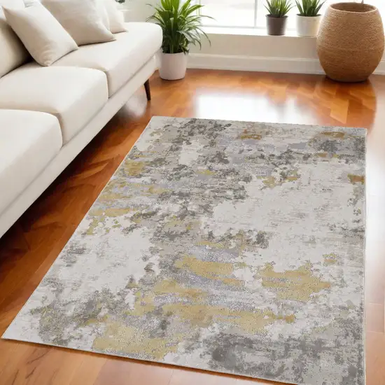 Ivory Gold And Gray Abstract Stain Resistant Area Rug Photo 1