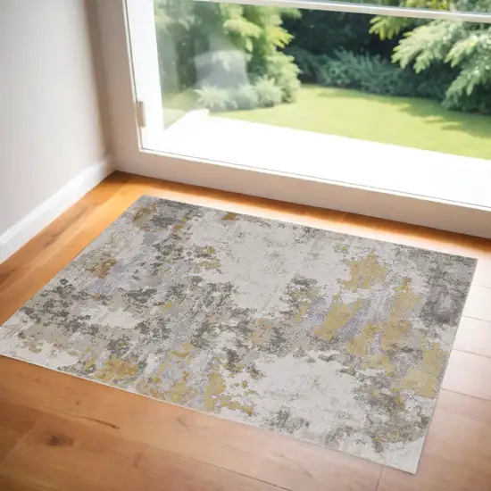 Ivory Gold And Gray Abstract Stain Resistant Area Rug Photo 1