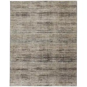 Photo of Ivory Gray And Black Abstract Distressed Area Rug With Fringe