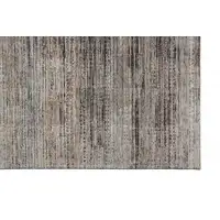 Photo of Ivory Gray And Black Abstract Distressed Area Rug With Fringe