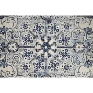 Photo of Ivory Gray And Blue Floral Power Loom Distressed Stain Resistant Area Rug