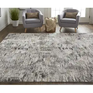 Photo of Ivory Gray And Brown Abstract Power Loom Distressed Stain Resistant Area Rug