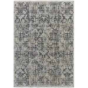 Photo of Ivory Gray And Taupe Abstract Power Loom Distressed Area Rug With Fringe