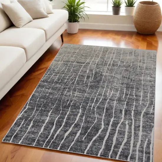 Ivory Gray and Black Abstract Power Loom Area Rug Photo 1