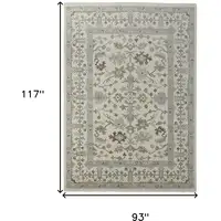 Photo of Ivory Gray and Brown Wool Floral Hand Knotted Area Rug With Fringe