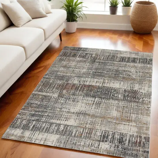 Ivory Gray and Golden Brown Abstract Area Rug Photo 1