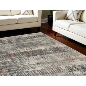 Photo of Ivory Gray and Golden Brown Abstract Area Rug