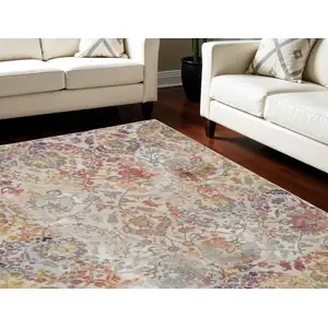 Photo of Ivory Gray and Orange Floral Distressed Non Skid Area Rug