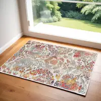 Photo of Ivory Gray and Orange Floral Distressed Non Skid Area Rug