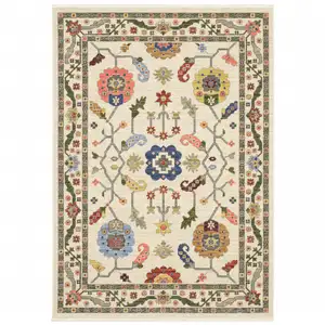 Photo of Ivory Green Blues Pink Yellow Rust Brown Tan And Grey Oriental Power Loom Stain Resistant Area Rug With Fringe