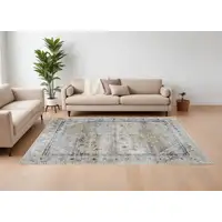 Photo of Ivory Green and Blue Abstract Power Loom Worn Faded Area Rug